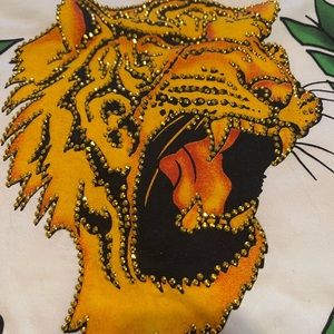 New with tags gold studs on a lions face